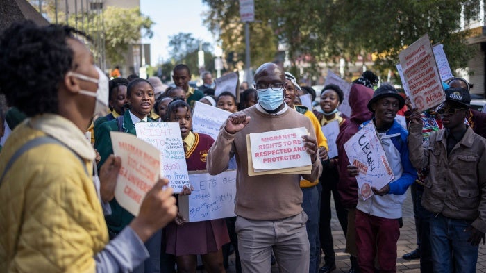 Protestors demonstrate in front of the South African Human Rights Commission (SAHRC) against xenophobia and vigilantism in the country, Johannesburg, during Africa Day, May 25, 2022.